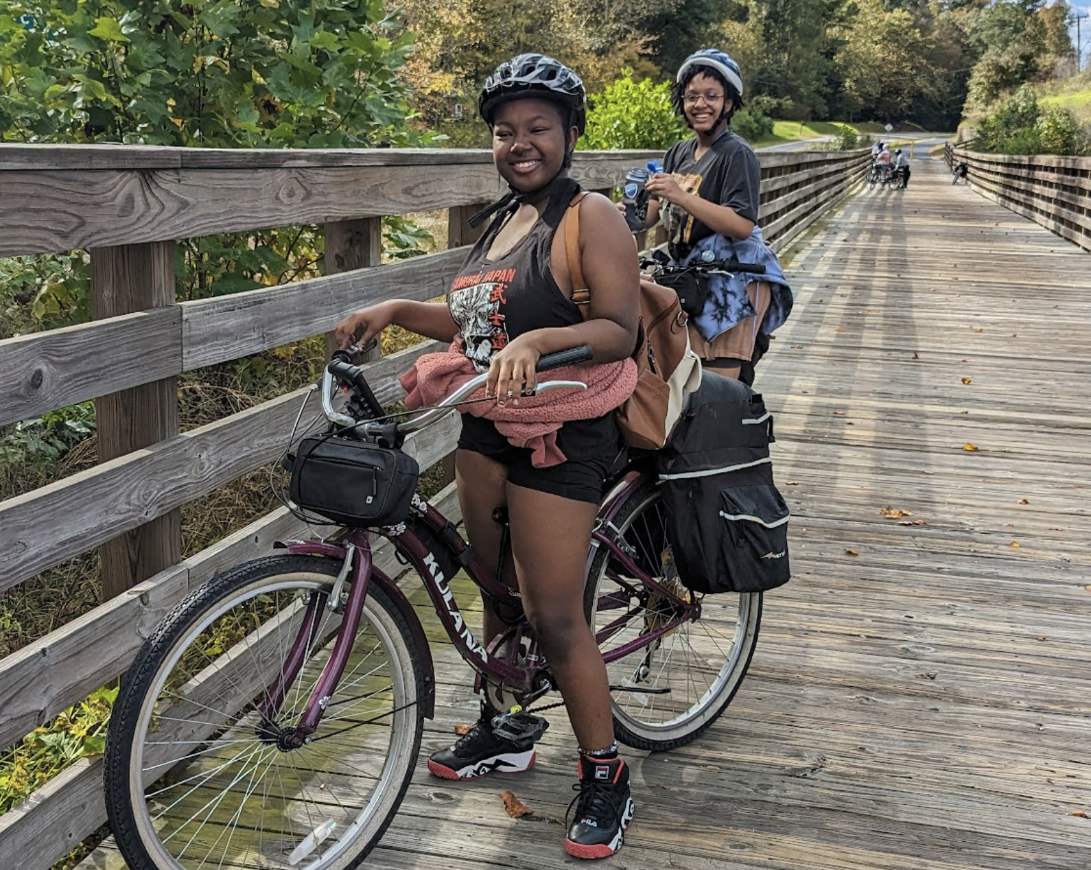 cyclist on a wooded bridge